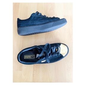 Puma black and gold sneakers